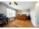 Bedroom with wood floors, large window with blinds and curtains, bed, desk and dresser at 5664 Norwood Ridge Dr, Rock Hill, SC 29732