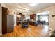 Open kitchen featuring dark cabinetry, stainless appliances, and an island with seating at 5664 Norwood Ridge Dr, Rock Hill, SC 29732