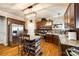 Open kitchen features an island with bar stool seating, granite counters, and stainless steel appliances at 5664 Norwood Ridge Dr, Rock Hill, SC 29732