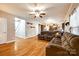 Spacious living area with hardwood floors that flows into the kitchen with stainless appliances at 5664 Norwood Ridge Dr, Rock Hill, SC 29732
