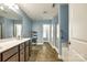 Well-lit bathroom boasting a double vanity, a large mirror, and tile flooring at 5664 Norwood Ridge Dr, Rock Hill, SC 29732