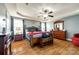 Spacious main bedroom suite with a tray ceiling, hardwood floors, and a large window at 5664 Norwood Ridge Dr, Rock Hill, SC 29732