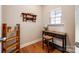 Cozy office with natural light, wood floors, decorative shelves, and a functional workspace at 5664 Norwood Ridge Dr, Rock Hill, SC 29732