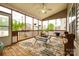 Inviting screened porch with a ceiling fan and views of the landscaped backyard at 5664 Norwood Ridge Dr, Rock Hill, SC 29732