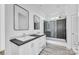 Modern bathroom featuring double vanity, shower, and decorative mirror at 603 Mt. Wesley Church Rd, Hiddenite, NC 28636