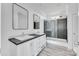 Modern bathroom featuring double vanity, shower, and decorative mirror at 603 Mt. Wesley Church Rd, Hiddenite, NC 28636