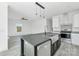 Kitchen with gray countertops and island open to the living room at 603 Mt. Wesley Church Rd, Hiddenite, NC 28636