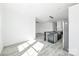 Open living and kitchen area with stainless steel appliances and gray island at 603 Mt. Wesley Church Rd, Hiddenite, NC 28636