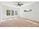 Bright bedroom featuring multiple windows and hardwood floors at 605 Arrow Point Ln, Davidson, NC 28036