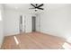 Bedroom featuring a ceiling fan, hardwood floors, and white walls at 605 Arrow Point Ln, Davidson, NC 28036