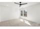 Bedroom with a ceiling fan, recessed lights, carpet, and natural light at 605 Arrow Point Ln, Davidson, NC 28036