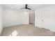 Bedroom features carpet, a ceiling fan, recessed lights, and a door at 605 Arrow Point Ln, Davidson, NC 28036
