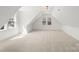 Bright, carpeted bonus room with dormer windows at 605 Arrow Point Ln, Davidson, NC 28036