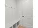 Mud room featuring coat hooks, storage bench, and a door to the interior at 605 Arrow Point Ln, Davidson, NC 28036