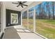 A screened-in porch provides an ideal outdoor sitting area with view of the backyard at 605 Arrow Point Ln, Davidson, NC 28036