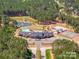 Beautiful aerial view of community amenities, including pool, playground, pond and clubhouse at 6422 Chimney Bluff Rd, Lancaster, SC 29720