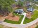 Aerial view of a luxury home featuring a long driveway and lush landscaping at 6422 Chimney Bluff Rd, Lancaster, SC 29720
