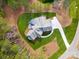 Aerial view of an upscale house with manicured lawn and circular driveway at 6422 Chimney Bluff Rd, Lancaster, SC 29720