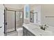 Modern bathroom with black-framed shower, gray tile, white vanity and quartz countertop at 6422 Chimney Bluff Rd, Lancaster, SC 29720