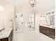 Luxurious bathroom with separate glass door showers and dual vanities at 6422 Chimney Bluff Rd, Lancaster, SC 29720
