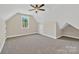 Large bedroom with a vaulted ceiling, ceiling fan, carpet, and a window at 6422 Chimney Bluff Rd, Lancaster, SC 29720