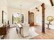 Dining room with wood beam accents, large window, hardwood flooring, and a modern chandelier at 6422 Chimney Bluff Rd, Lancaster, SC 29720
