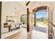Open dining room with hardwood floors, modern lighting, and a view to the outside at 6422 Chimney Bluff Rd, Lancaster, SC 29720