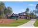 Stunning home with manicured lawn, stone accents, and long driveway at 6422 Chimney Bluff Rd, Lancaster, SC 29720