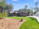 Charming home with manicured lawn, stone accents, and mature trees at 6422 Chimney Bluff Rd, Lancaster, SC 29720