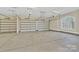 Spacious three-car garage with automatic doors and a window at 6422 Chimney Bluff Rd, Lancaster, SC 29720