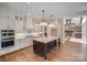 Gourmet kitchen features a center island, stone fireplace, and stainless steel appliances at 6422 Chimney Bluff Rd, Lancaster, SC 29720