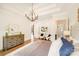 Relaxing primary bedroom showcases a trey ceiling, chandelier, and stylish decor at 6422 Chimney Bluff Rd, Lancaster, SC 29720