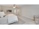 Cozy bedroom with neutral colors, a ceiling fan, and access to an ensuite bathroom at 6804 Riesman Ln, Charlotte, NC 28210