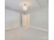 Bedroom with carpet, recessed lighting, closet, and a modern light fixture at 6804 Riesman Ln, Charlotte, NC 28210