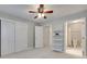 Bright bedroom with ceiling fan, double closets and easy access to an ensuite bathroom at 6804 Riesman Ln, Charlotte, NC 28210