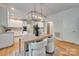 Elegant dining area with a modern light fixture, and neutral color palette at 6804 Riesman Ln, Charlotte, NC 28210