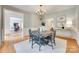 Formal dining room with grey walls, traditional chandelier and trim detail at 6804 Riesman Ln, Charlotte, NC 28210