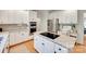 Bright kitchen featuring stainless steel appliances, granite countertops, and a center island cooktop at 6804 Riesman Ln, Charlotte, NC 28210