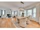 Bright living room featuring a fireplace, hardwood floors, neutral furnishings, and lots of natural light at 6804 Riesman Ln, Charlotte, NC 28210