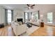 Comfortable living room with fireplace, hardwood floors, and neutral color palette at 6804 Riesman Ln, Charlotte, NC 28210