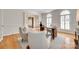 Light-filled office featuring hardwood flooring, and soft, natural light from the two large windows at 6804 Riesman Ln, Charlotte, NC 28210