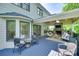 Inviting outdoor deck featuring a stone fireplace, comfortable seating, and stylish outdoor chairs at 6804 Riesman Ln, Charlotte, NC 28210