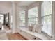 Cozy window seat with plush pillows, built-in storage, and a view of the outdoors at 6804 Riesman Ln, Charlotte, NC 28210