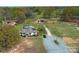 Beautiful aerial view of property showcasing home, barn and surrounding acreage at 7514 Secrest Shortcut Rd, Indian Trail, NC 28079