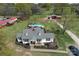 An aerial view showcases this home with a pool, barn, and landscaping at 7514 Secrest Shortcut Rd, Indian Trail, NC 28079