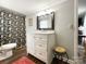Charming bathroom showcasing a new vanity, modern lighting, and a colorful shower curtain at 7514 Secrest Shortcut Rd, Indian Trail, NC 28079
