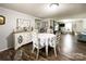 Open dining area with hardwood floors, decorative accents, and seamless flow to living space, ideal for entertaining at 7514 Secrest Shortcut Rd, Indian Trail, NC 28079