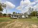Charming single-story home with a well-maintained lawn and classic architectural details at 7514 Secrest Shortcut Rd, Indian Trail, NC 28079