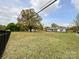 Expansive front yard featuring a large shade tree, mature lawn, and a charming single story home at 7514 Secrest Shortcut Rd, Indian Trail, NC 28079