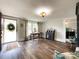 Inviting living room with dark wood floors, large windows, and lots of natural light at 7514 Secrest Shortcut Rd, Indian Trail, NC 28079